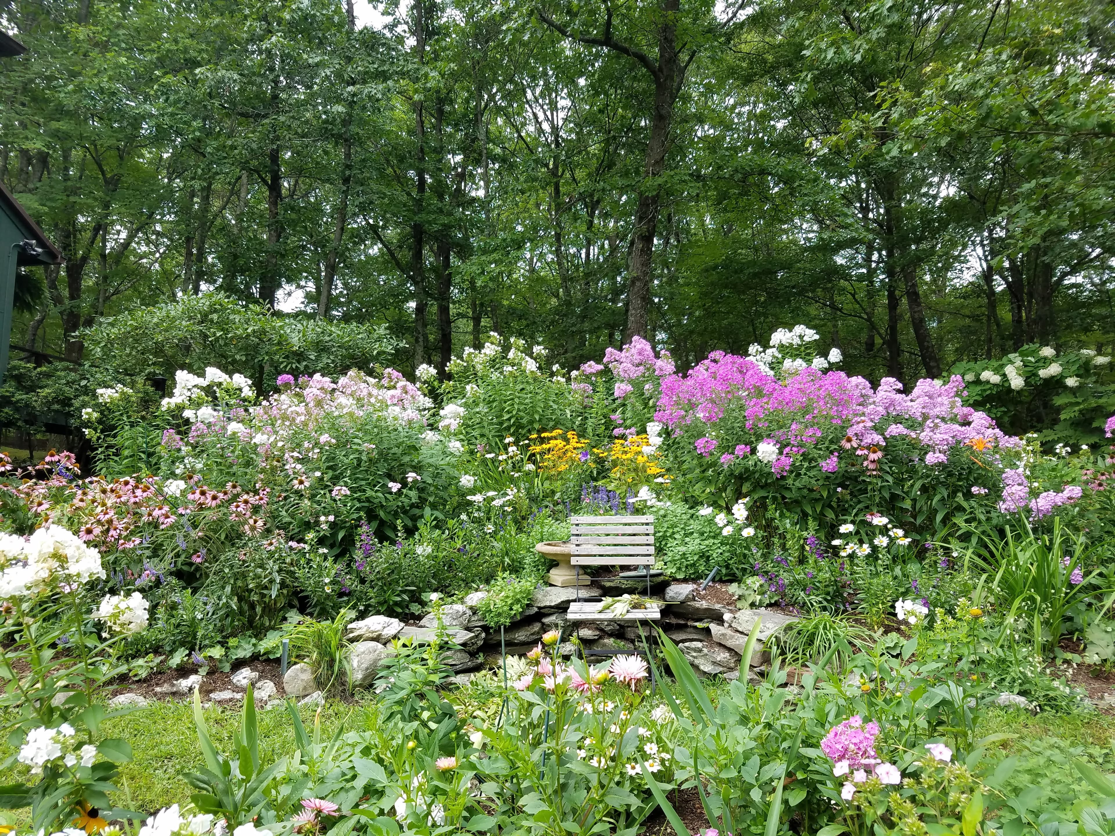Stone house and manicured grounds.